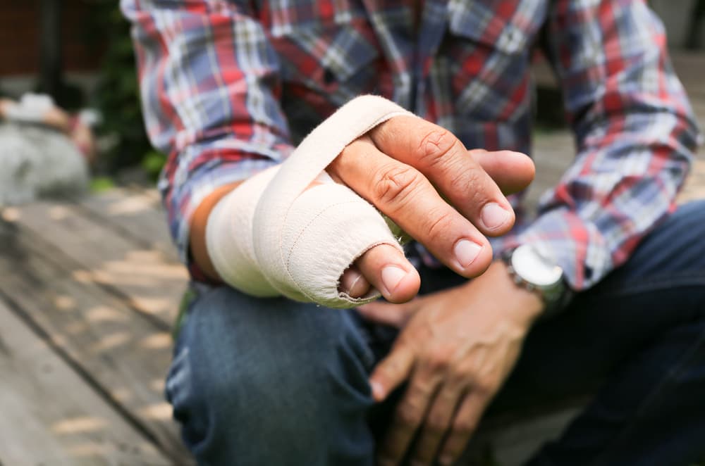 A victim's hand with a broken bone immobilized in a splint after car accident in Miami, FL
