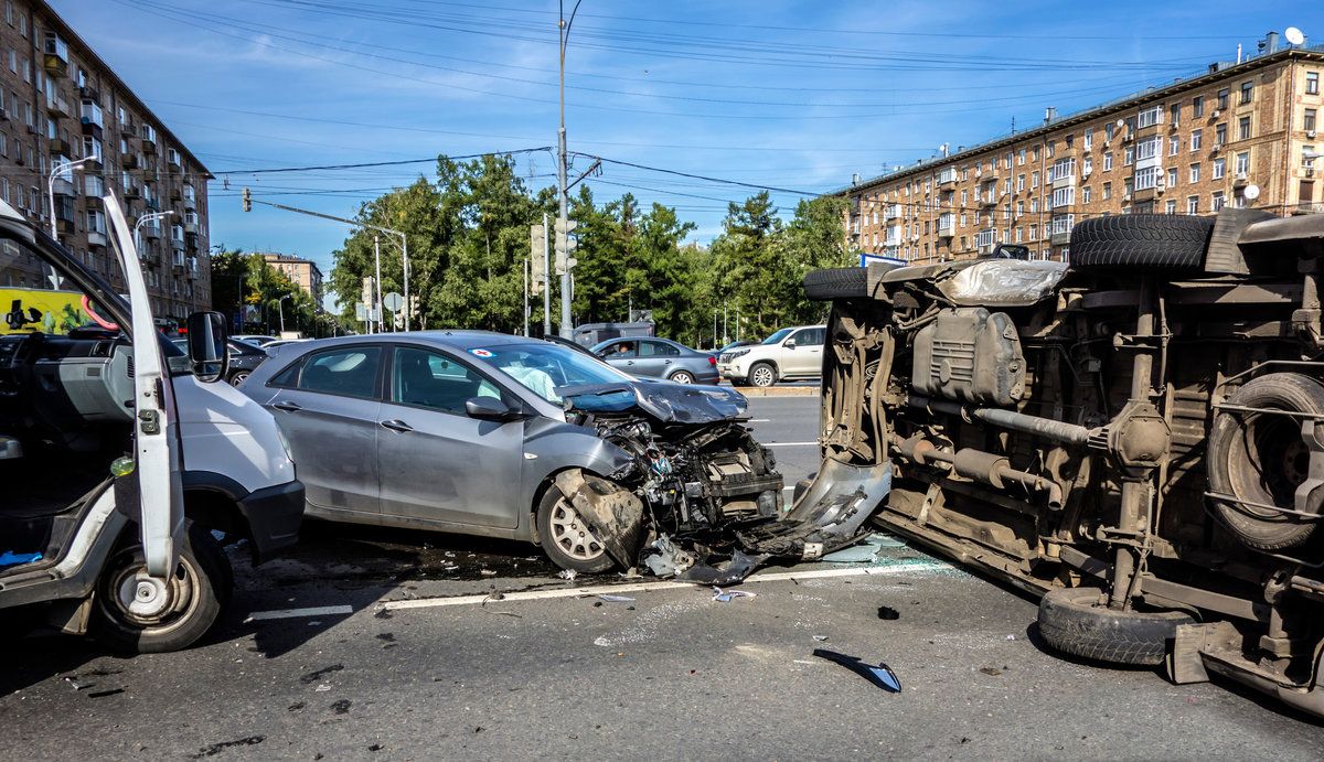 Accident involving an overturned ambulance ranning into a car and rolled over